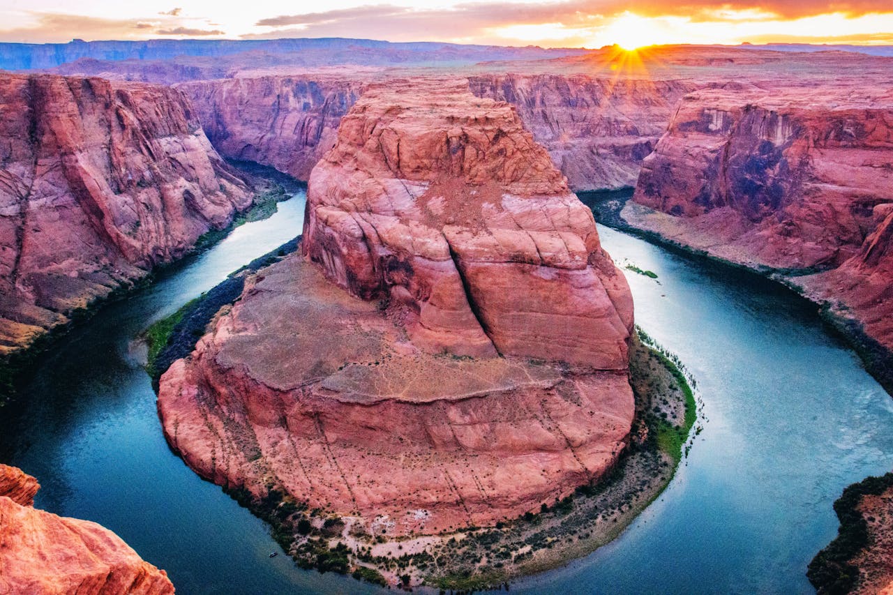 Captivating aerial view of Horseshoe Bend at sunset in Page, Arizona, highlighting the Colorado Rivers unique curve.
